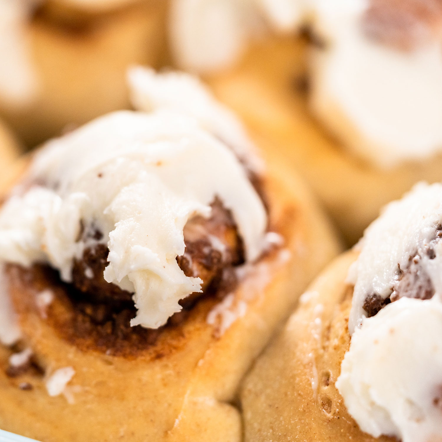 Warm cinnamon rolls topped with cream cheese frosting.